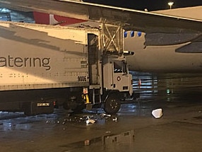 Debris of the aircraft and the catering van after the mishap.