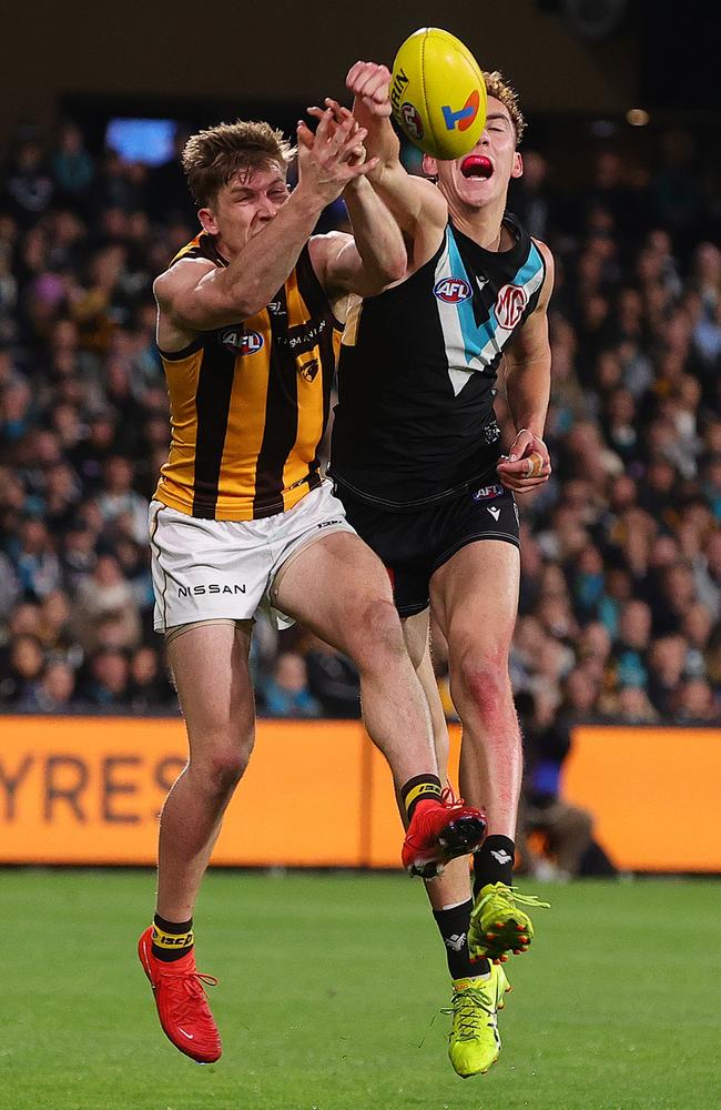 Logan Evans spoils Dylan Moore in the semi-final against Hawthorn. Picture: Sarah Reed/AFL Photos