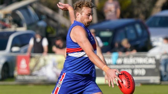 Mornington’s Jackson Calder takes a kick on Saturday. Picture: Valeriu Campan