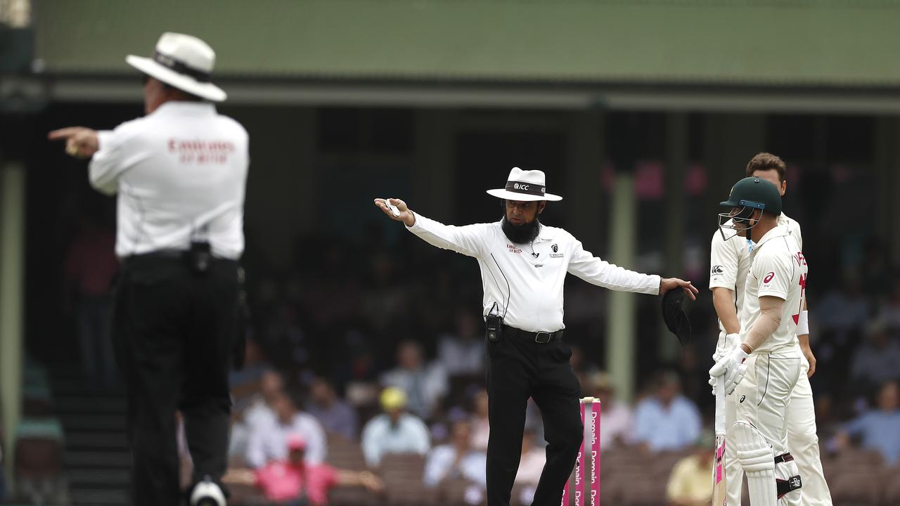 Umpire Aleem Dar signals the five-run penalty. Picture: Getty