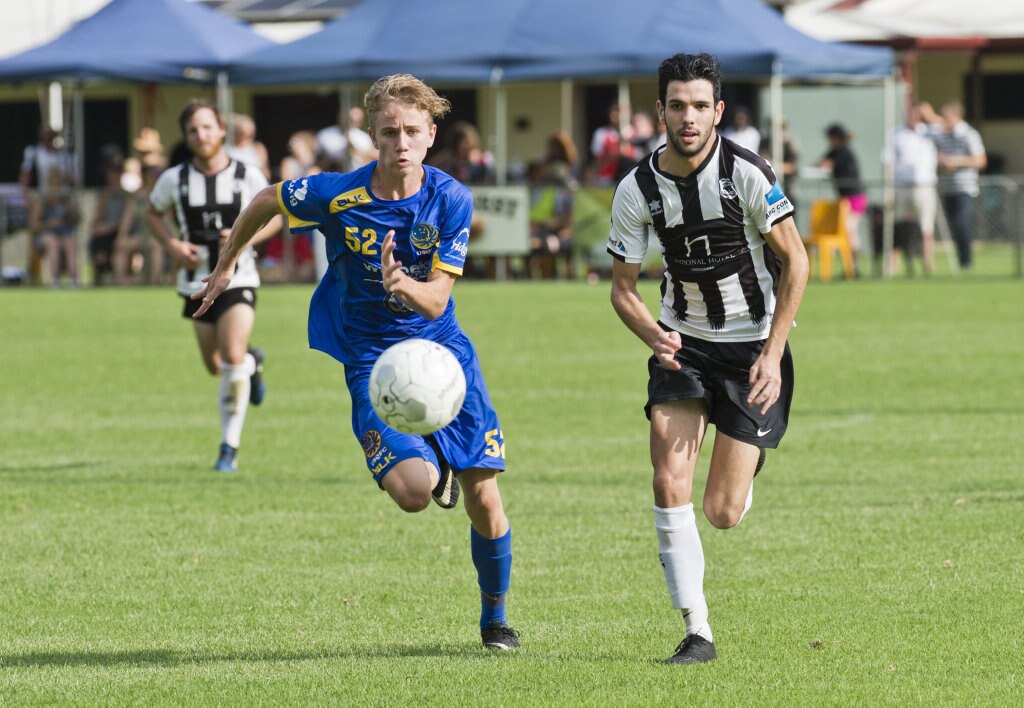 Cormac McCarthy, USQ and Callum Hart, Willowburn. Football, Willowburn vs USQ. Sunday, 4th Mar, 2018. Picture: Nev Madsen