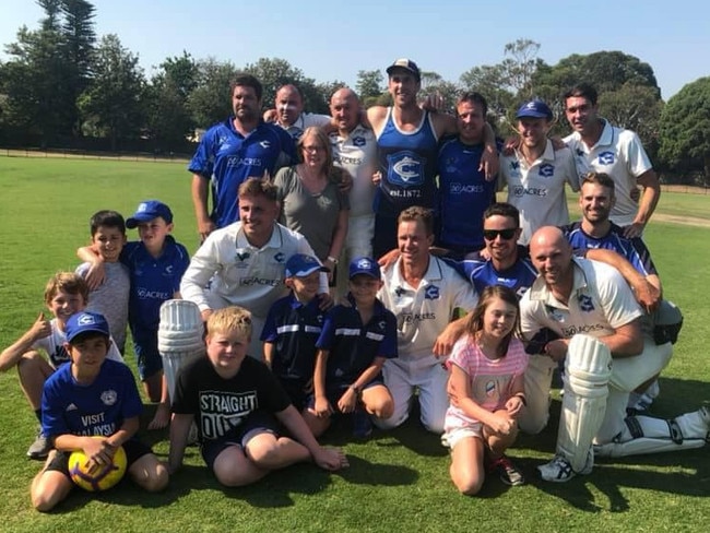 Cheltenham players and supporters bunch for a premiership photo after winning the 2018-19 Cricket Southern Bayside Division 2 grand final.