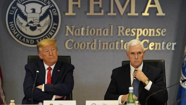 Donald Trump and Mike Pence at the Federal Emergency Management Agency headquarters. Picture: AP.