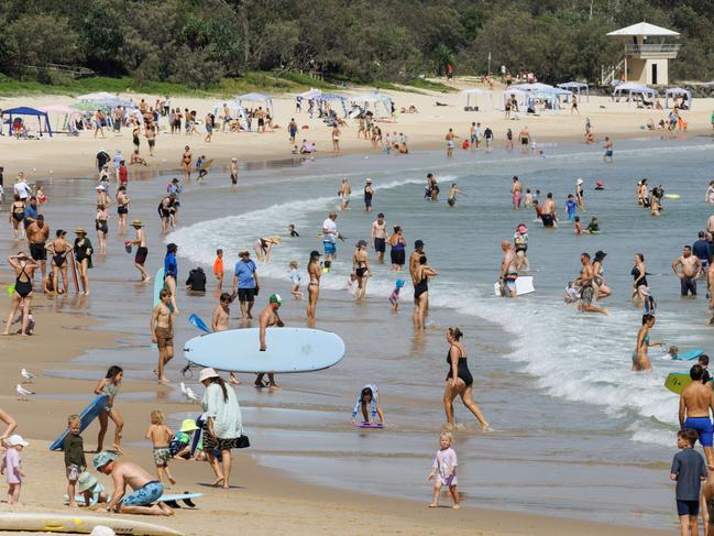 Holiday crowds at Noosa Main Beach. Picture Lachie Millard