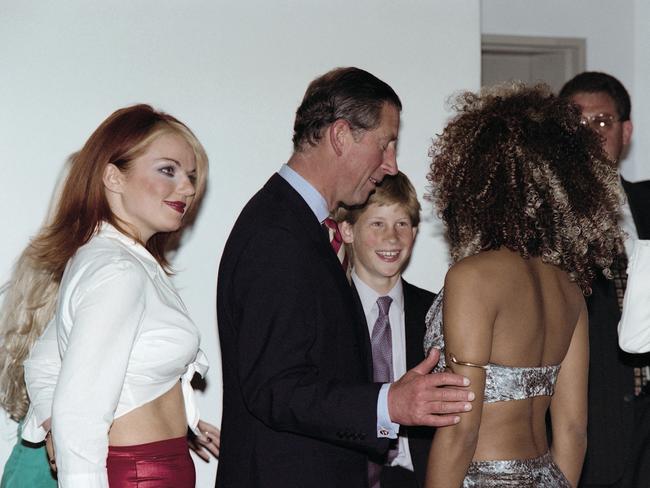 Prince Charles and his son Harry flanked by members of the British pop group Spice Girls. Picture: AFP