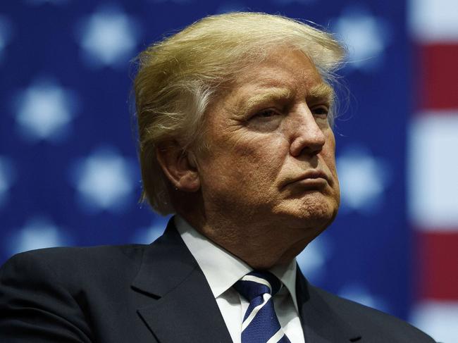 GRAND RAPIDS, MI - DECEMBER 9: President-elect Donald Trump looks on during a rally at the DeltaPlex Arena, December 9, 2016 in Grand Rapids, Michigan. President-elect Donald Trump is continuing his victory tour across the country. Drew Angerer/Getty Images/AFP == FOR NEWSPAPERS, INTERNET, TELCOS & TELEVISION USE ONLY ==