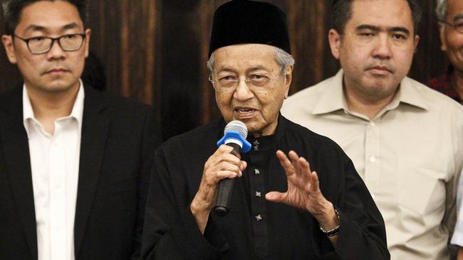 Malaysian Prime Minister Mahathir Mohamad, centre, talks during a press conference in Petaling Jaya, Malaysia last night.