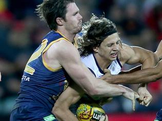 30/5/15 - AFL round 9 - Adelaide Crows v Fremantle Dockers at Adelaide Oval - Nat Fyfe is tackled by Patrick Dangerfield and Eddie Betts Pic Simon Cross