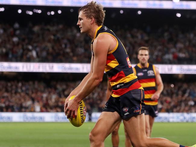 ADELAIDE, AUSTRALIA - APRIL 01: Jordan Dawson of the Crows lines up to kick the winning goal during the 2022 AFL Round 03 match between the Adelaide Crows and the Port Adelaide Power at Adelaide Oval on April 01, 2022 In Adelaide, Australia. (Photo by Sarah Reed/AFL Photos via Getty Images)