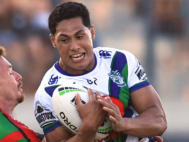 Roger Tuivasa-Sheck (right) of the Warriors is tackled by Damien Cook (left) of the Rabbitohs during the Round 5 NRL match between the South Sydney Rabbitohs and the New Zealand Warriors at Sunshine Coast Stadium on the Sunshine Coast, Saturday, April 13, 2019. (AAP Image/Darren England) NO ARCHIVING, EDITORIAL USE ONLY