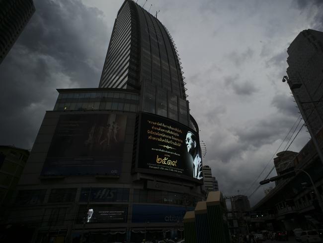 Photos of the late Thai King Bhumibol Adulyadej are projected on electronic billboards. Picture: AP