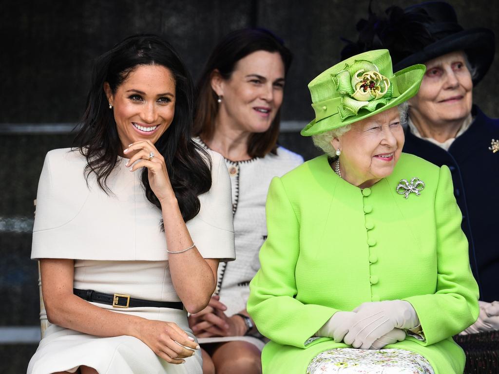 Queen Elizabeth II sits with Meghan, Duchess of Sussex accompanied by Samantha Cohen (Back, centre) during a ceremony to open the new Mersey Gateway Bridge on June 14, 2018 in the town of Widnes in Halton, Cheshire. Picture: Getty