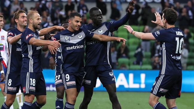 Andrew Nabbout of Melbourne Victory celebrates his goal with Migjen Basha (left) and Kenny Athiu (right) with provider Robbie Kruse during the Round 13 A-League match between Melbourne Victory and Newcastle Jets at AAMI Park in Melbourne, Sunday, January 5, 2020. (AAP Image/George Salpigtidis) NO ARCHIVING, EDITORIAL USE ONLY