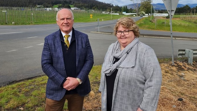 Transport Minister Eric Abetz and Huon Valley Council Mayor Sally Doyle pictured in front of the Huon Highway-Mountain River Road intersection in October last year. Picture: Huon Valley Council