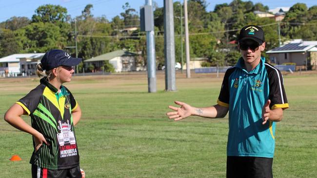 Mitch and Natalie De Rossi help Gayndah's junior touch players brush up on their skills.