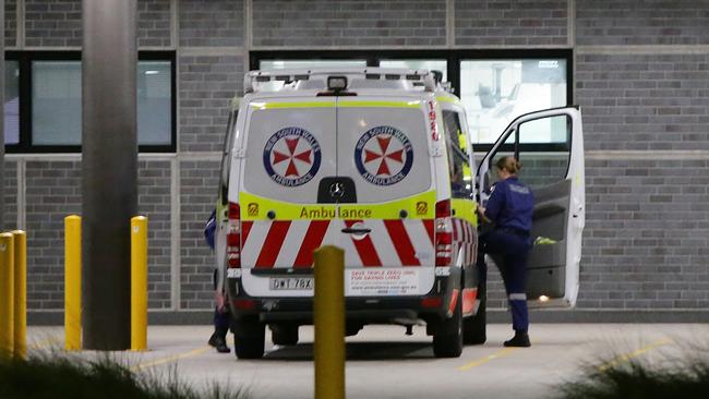 Paramedics at Blacktown Hospital as the number of infections across the regions passes 70. Picture: Bill Hearne