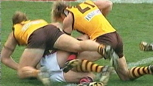 All-in brawls, like the infamous one between Hawthorn and Essendon in 2004, are far less frequent. Picture: Fox Footy