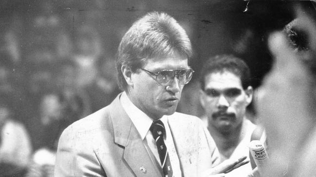 Basketball coach Brian Kerle coaching team during time-out. NBL basketball – Adelaide 36ers vs. Brisbane Bullets grand final game three at Apollo Stadium in Richmond, SA 19 Oct 1986.