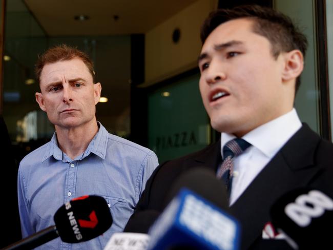 SYDNEY, AUSTRALIA - NewsWire Photos OCTOBER 31, 2023:  Daniel Muston (centre) leaves the Downing Centre local court on Tuesday. Three men were charged after they allegedly performed a Nazi salute outside the Sydney Jewish Museum. Picture: NCA NewsWire / Nikki Short