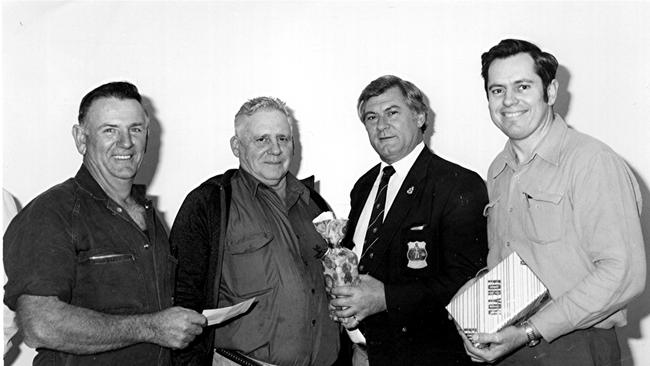 John MacPherson (right) with (2nd from left) Bob Weatherall, Mick Venardos (3rd from left) and the President of the Gympie City Council Social Club (Mr MacPherson was unable to recall the name) in 1985.