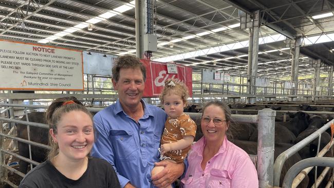 Michael and Sue Spagnolo sold the first three pens of the sale to a top of $2250 twice for 20 and 24 Angus steers. They are pictured with their daughter Chelsea, left, and granddaughter Eden, 16 months, at the Elders Yea feature weaner sale. Picture: Petra Oates