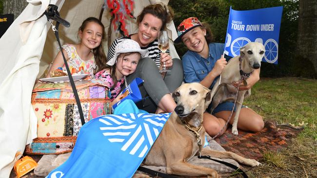 Amity Hall-Heffer, 8, Lucy Langhans, 4, Alex Weaver, 37, and Ely Hall-Heffer, 12, with dogs Mikah and Dashi wait for the peloton to pass through Mylor. Picture: Tricia Watkinson