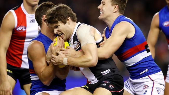 Nathan Freeman is tackled by Josh Dunkley and Jack Macrae.