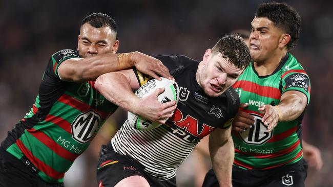 Liam Martin tries to bush a tackle during the preliminary final.