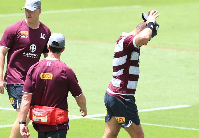 Brenko Lee walks off the training paddock following an apparent calf injury. Picture: Adam Head