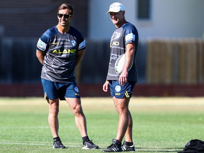 Johns and Brad Arthur talk shop at training. Picture: Supplied