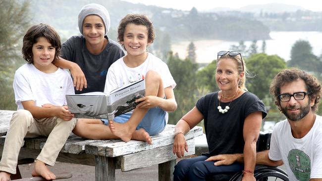 Sam and Cameron with their boys Reuben 14, Noah 12 and Oli ten, and their new book, Penguin Bloom. Picture: Supplied/Cameron Bloom