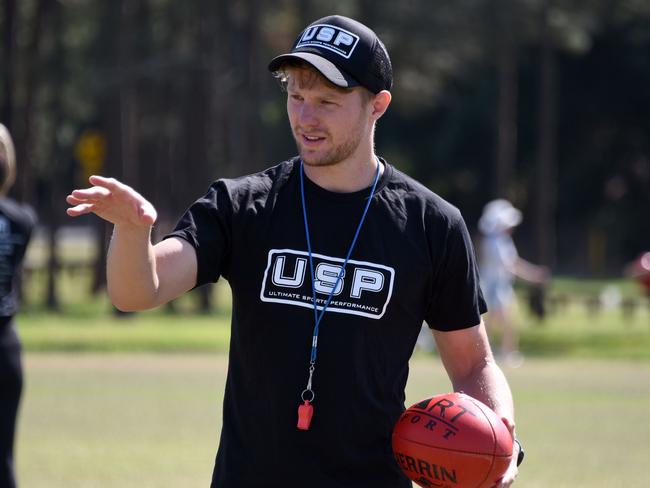 Former Golad Coast Suns player Mackenzie Willis coaching at an AFL off-season training camp. Picture: Steve Holland