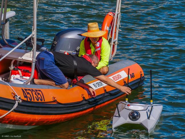 Australian Institute of Marine Science staff test the ReefScan reef monitoring technology on an autonomous surface vessel in the ReefWorks test ranges. Photo by Marie Roman, courtesy of AIMS.