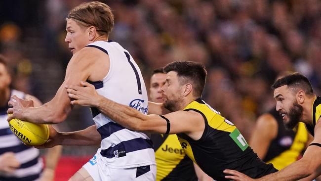 Trent Cotchin of the Tigers tackles Rhys Stanley of the Cats during the First Preliminary Final match between the Richmond Tigers and the Geelong Cats in Week 3 of the AFL Finals Series at the MCG in Melbourne, Friday, September 20, 2019. (AAP Image/Michael Dodge) NO ARCHIVING, EDITORIAL USE ONLY