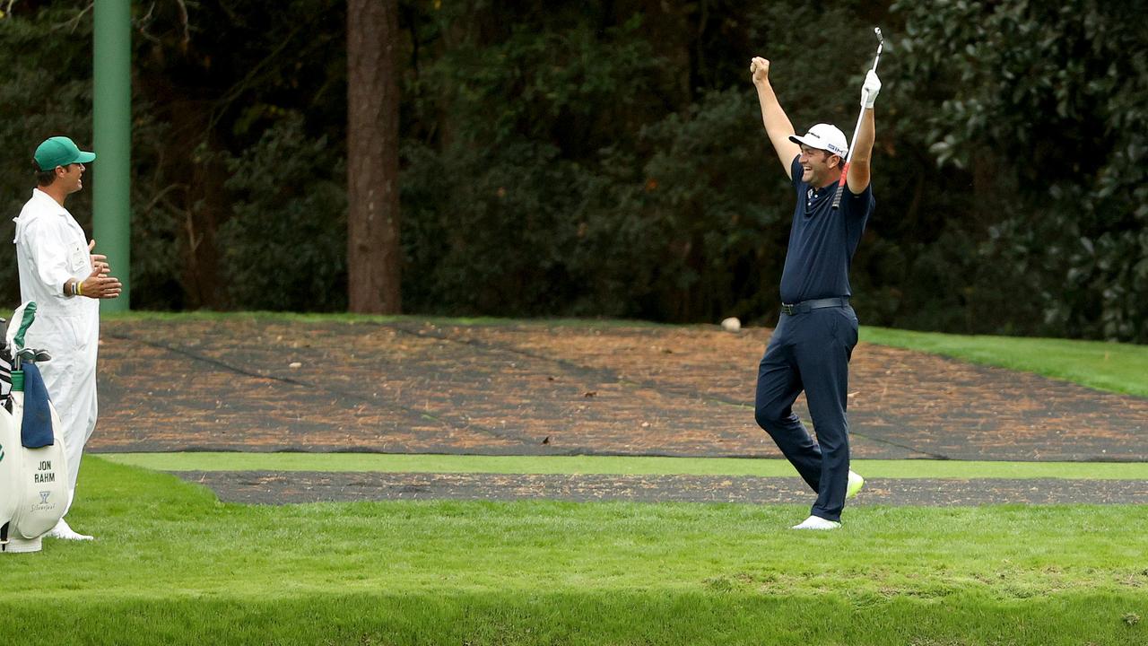 Jon Rahm celebrates after skipping in for a hole in one on the 16th during a practice round prior to the Masters. (Photo by Patrick Smith/Getty Images)