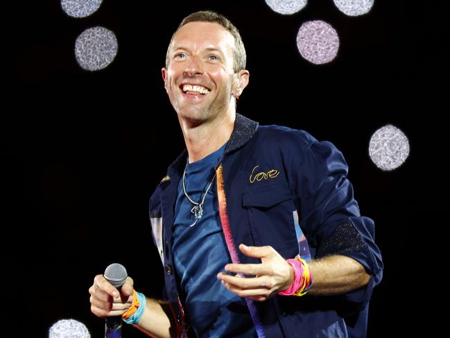 DAILY TELEGRAPH NOVEMBER 6, 2024. Chris Martin from Coldplay on stage at Accor Stadium at Sydney Olympic Park for their Music Of The Spheres World Tour concert. Picture: Jonathan Ng