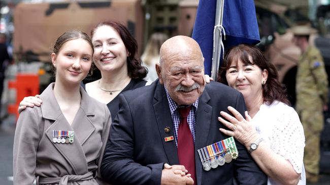L to R, Emily Clapham (grand daughter), Kym Clapham (daughter) with granddad Heta Heta, Jo Hera (wife), served for New Zealand in Vietnam 161 battery, lives at Riverhills, during the Anzac Day Parade, Brisbane City. Photo: Steve Pohlner