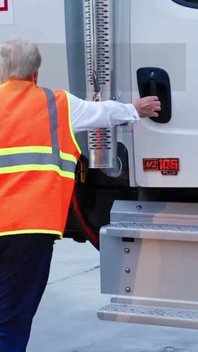 Donald Trump shows up in garbage truck