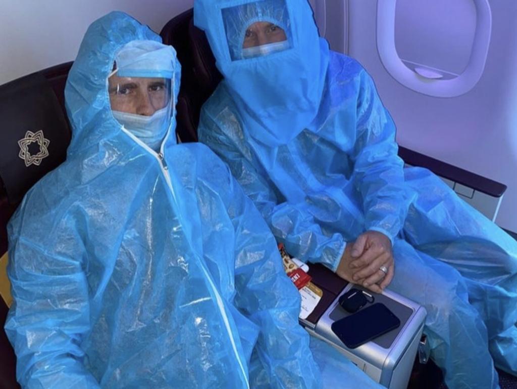 Australia’s David Warner shared a photo of himself with fellow IPL cricketer Kane Williamson of New Zealand in hazmat suits on a domestic flight in India as they remain stranded. Picture: Instagram.