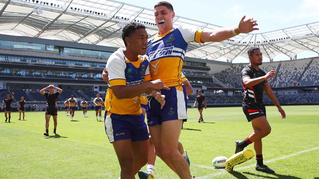 Sione Lino is emnbraced after scoring his try. Picture: Toby Zerna