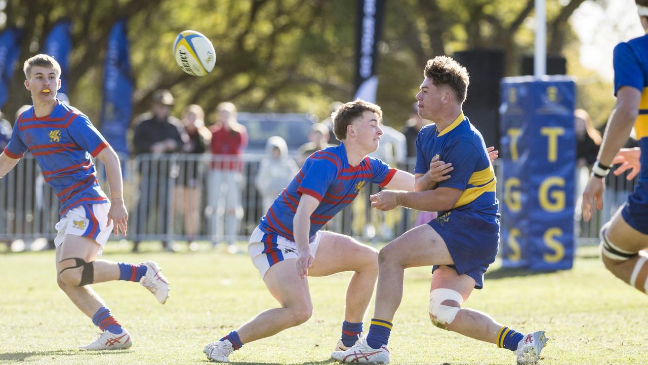 Grammar's Ewald Kruger gets a pass away in the O'Callaghan Cup on Grammar Downlands Day. Picture: Kevin Farmer