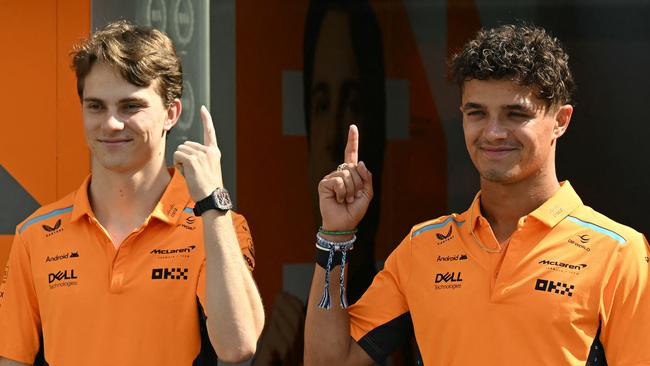 TOPSHOT - McLaren's Australian driver Oscar Piastri (L) and McLaren's British driver Lando Norris pose ahead of the Formula One Azerbaijan Grand Prix in Baku on September 12, 2024. (Photo by Natalia KOLESNIKOVA / AFP)