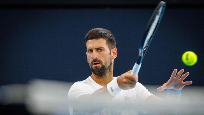 Serbian Novak Djokovic attends a training session before the Brisbane International tennis tournament in Brisbane on December 28, 2024. (Photo by Patrick HAMILTON / AFP) / -- IMAGE RESTRICTED TO EDITORIAL USE - STRICTLY NO COMMERCIAL USE --