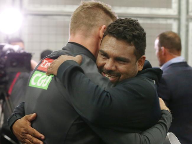 Collingwood coach Nathan Buckley hugs Kyron’s father (also Kyron) after the game. Picture: Michael Klein