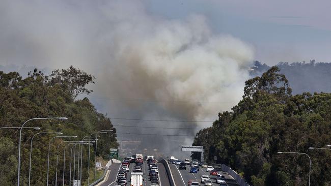 Traffic is slowed along the M1 heading south due to a grass fire along Mudgeeraba Rd, Mudgeeraba. Photo: Jerad Williams