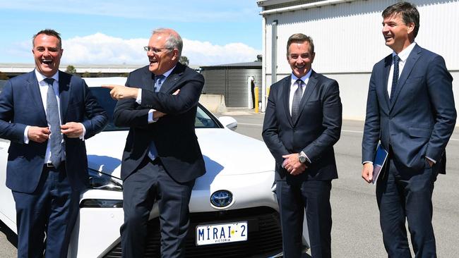 Scott Morrison, second left, with, from left, Liberal MP Tim Wilson, Toyota Australia president Matthew Callachor and Energy Minister Angus Taylor with a hydrogen-fuelled car in Melbourne. Picture: AFP