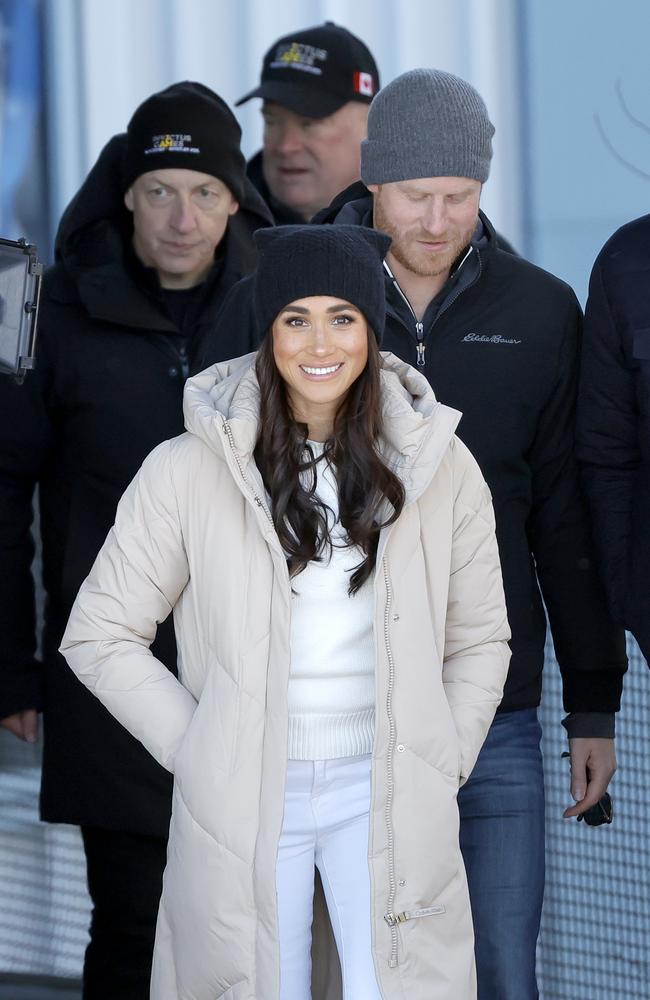 They smiled and held hands as they greeted officials and athletes. Picture: Andrew Chin/Getty Images