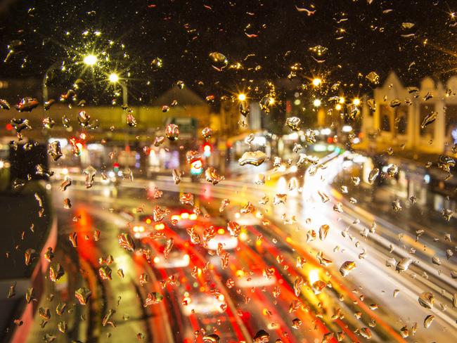 Spit Junction in the rain. Picture: Braden Fastier