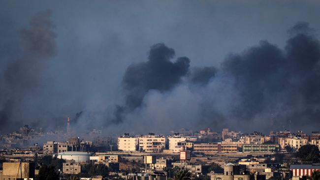 Smoke billows over buildings in Rafah in the southern Gaza Strip during Israeli bombardment on Thursday. Picture: AFP