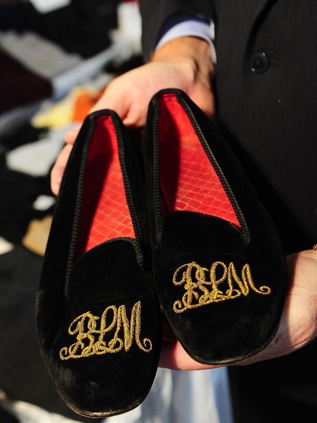 Slippers belonging to Madoff, embroidered with his initials in gold. Picture: AFP